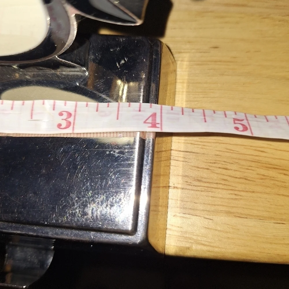 An unbranded Penguin Stocking Holder    It's base is 4